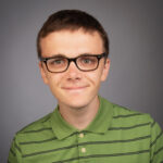 Headshot of Nathan Persampieri smiling at the camera