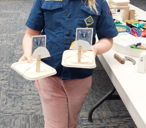 child's hands showing homemade adaptive equipment