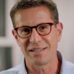 headshot photo of Dr. Ablon - a white man with short light hair, wearing glasses and smiling 